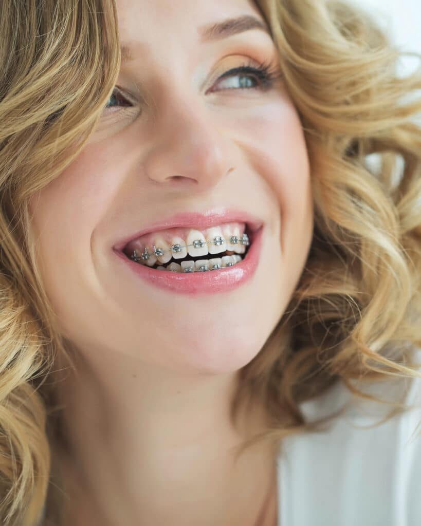 smiling girl with metal braces
